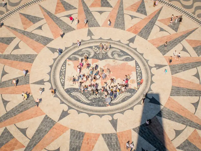 An aerial view of the Compass Rose at the Discoveries Monument, Lisbon, adorned with visitors.